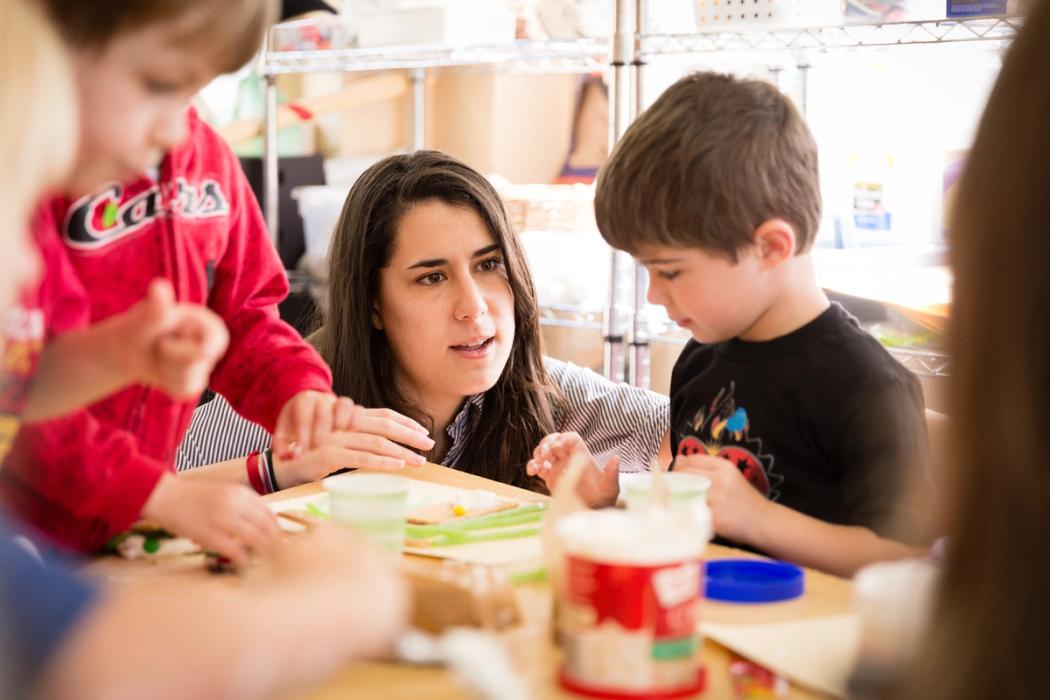 Rollins student works with a preschool child.