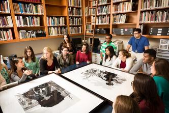 Art history students in the library of the Rollins Museum of Art.