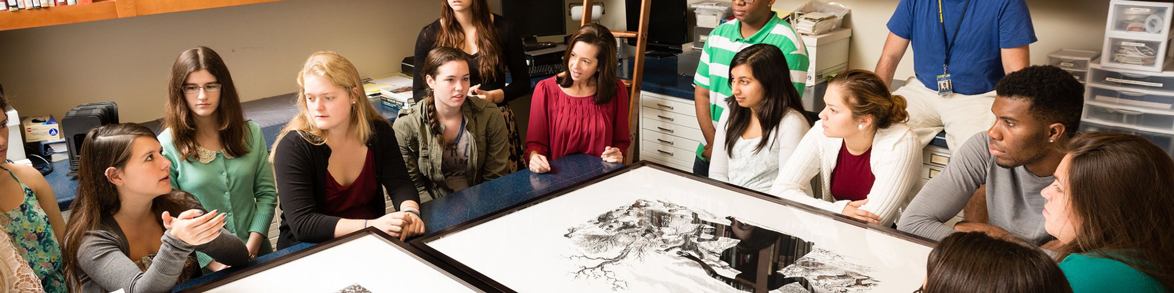 Art history students in the library of the Rollins Museum of Art.