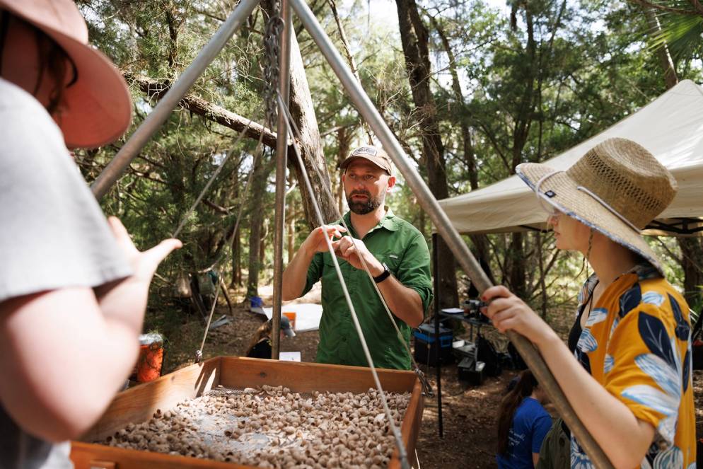 Anthropology professor Zack Gilmore and his students perform an excavation at nearby Shell Island.