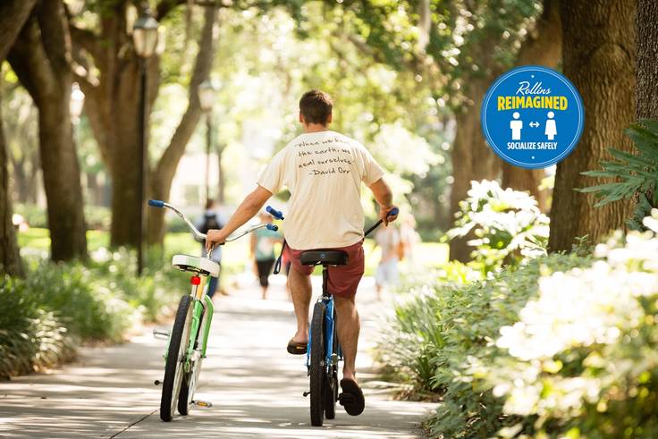 Student biking on campus.