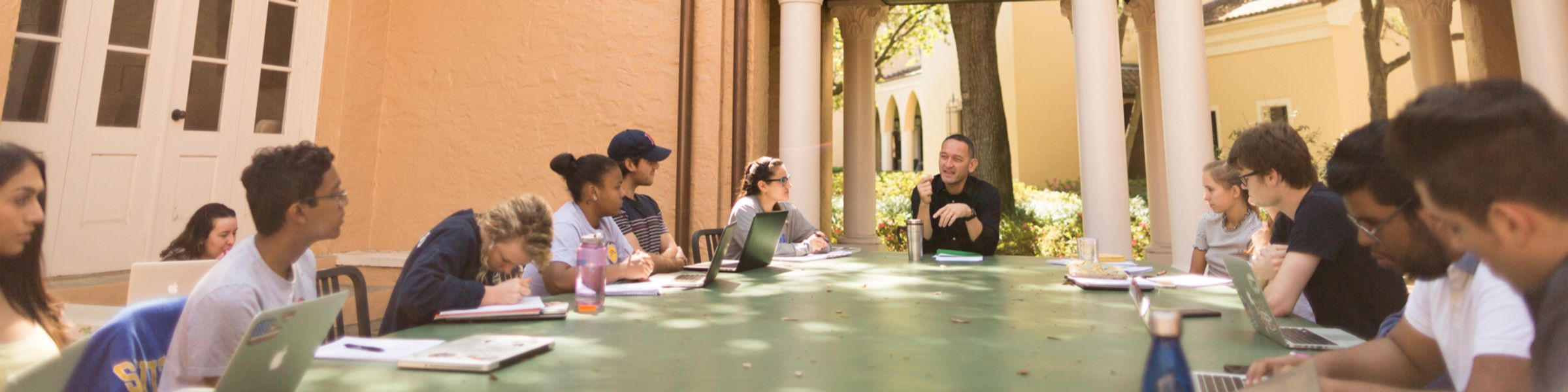 Political science professor Dan Chong holds class in Rollins’ outdoor classroom.