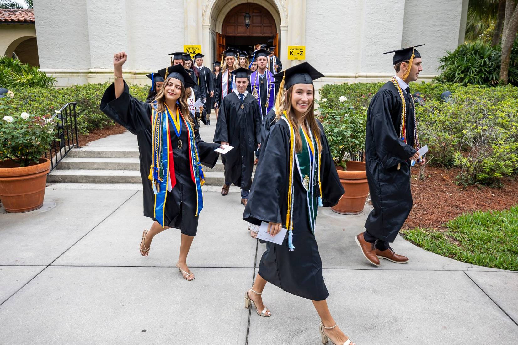 Students walk in Rollins' commencement ceremony