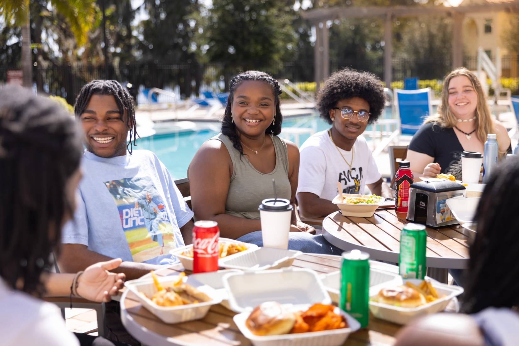 Students interacting at a campus patio.