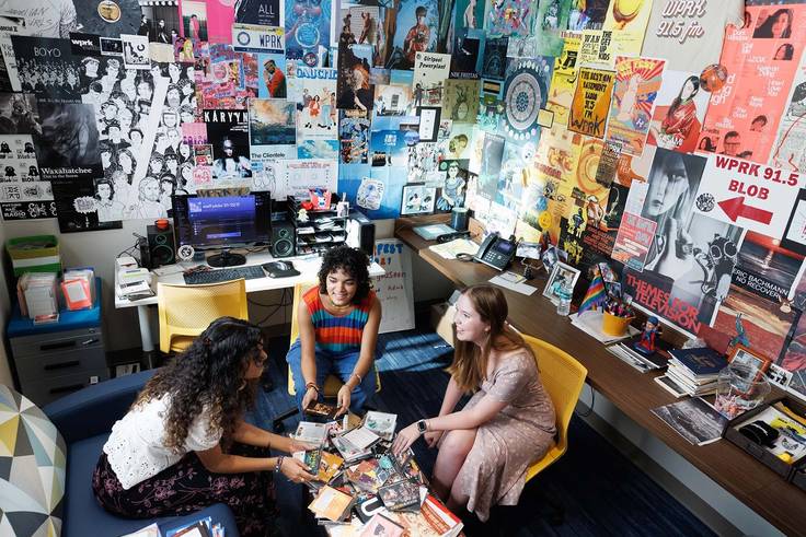 Student media volunteers sort through disks in the WPRK station manager's office, located in the new Kathleen W. Rollins hall..