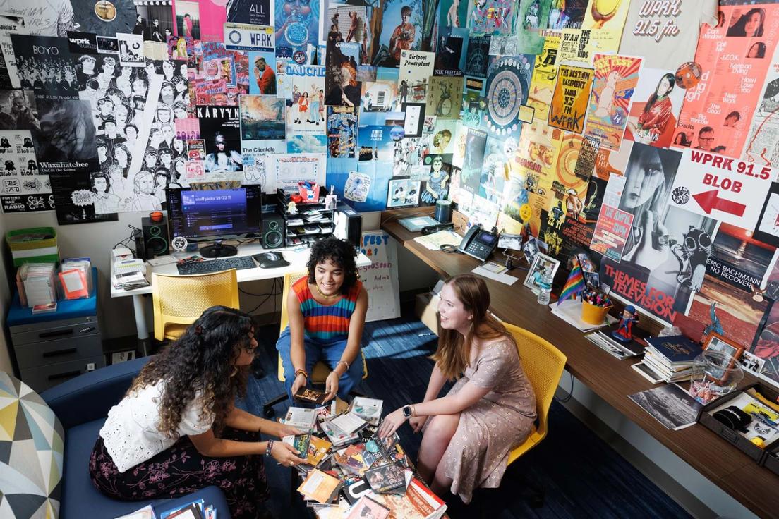 Student media volunteers sort through disks in the WPRK station manager's office, located in the new Kathleen W. Rollins hall.. 