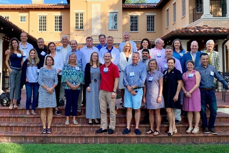 2022 Parents Council poses for a photo on the lawn of the Barker House at Rollins