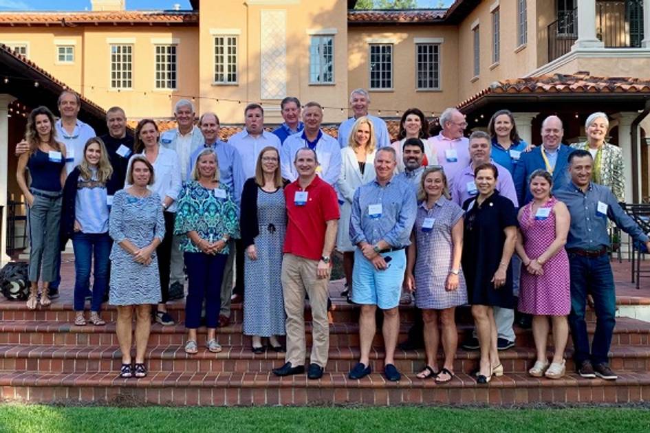 2022 Parents Council poses for a photo on the lawn of the Barker House at Rollins