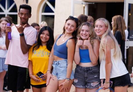 A group of first-year students pose together during orientation.