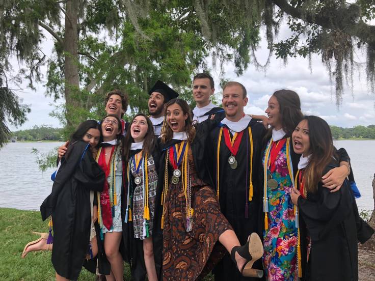 Carmen Cheng ’18 celebrating graduation with friends and fellow Alfond Scholars along the shores of Lake Virginia.