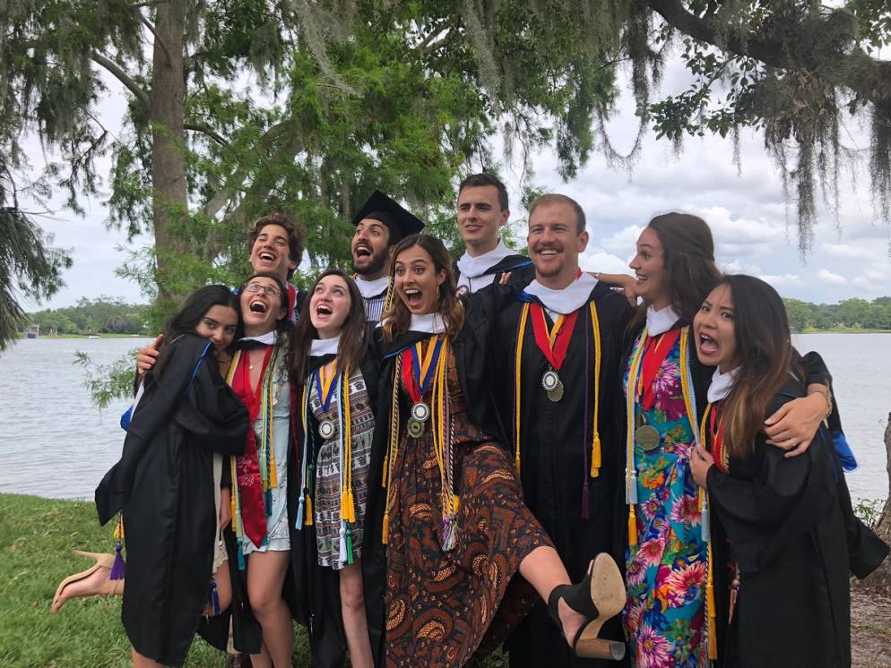 Carmen Cheng ’18 celebrating graduation with friends and fellow Alfond Scholars along the shores of Lake Virginia.