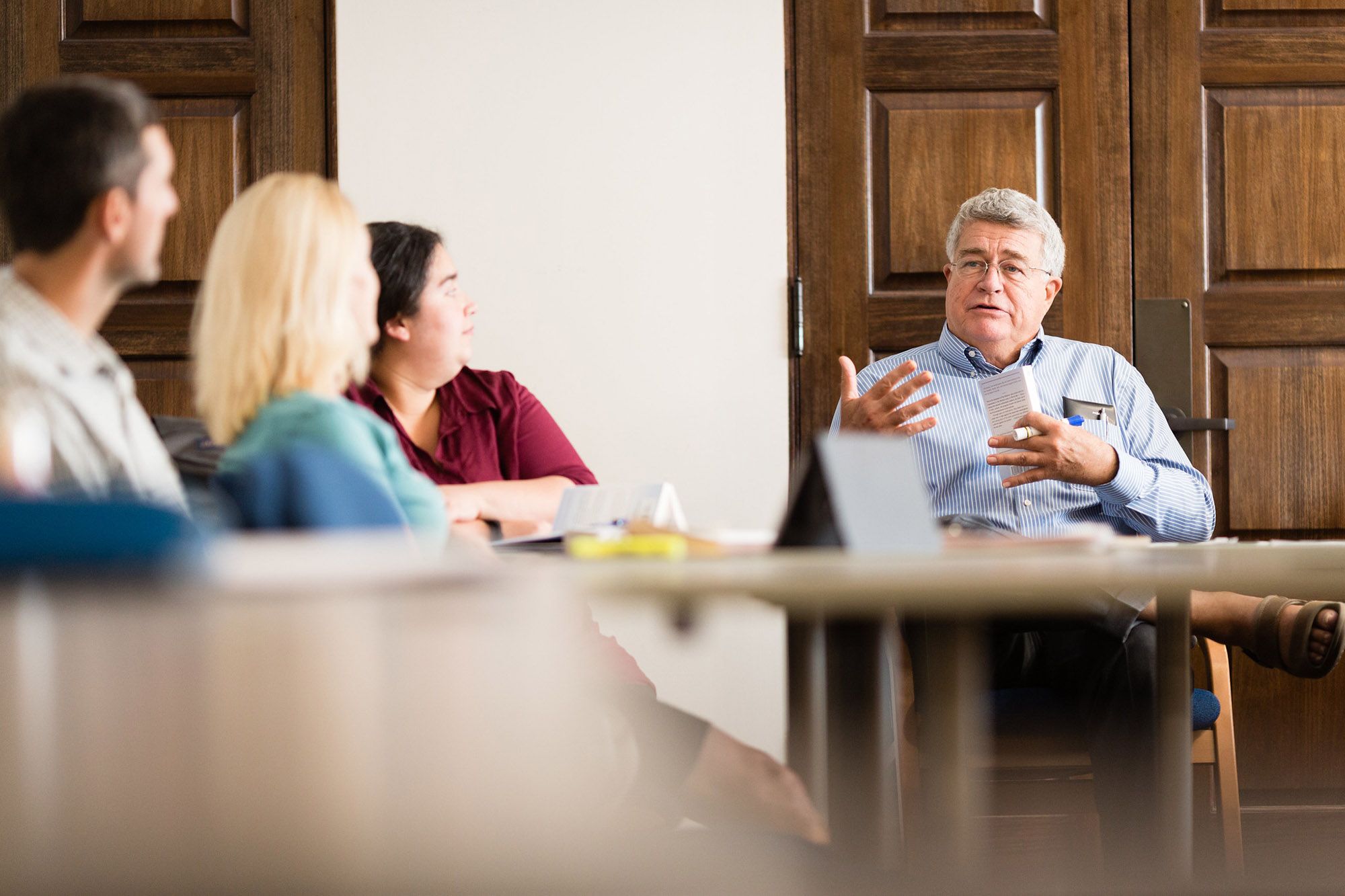 Philosophy professor Tom Cook discusses logic and reasoning with a class of students.