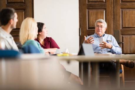 Philosophy professor Thomas Cook engages in class discussion with MLS students.