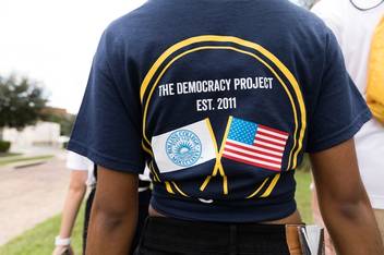 A student sports a Democracy Project T-shirt on campus.