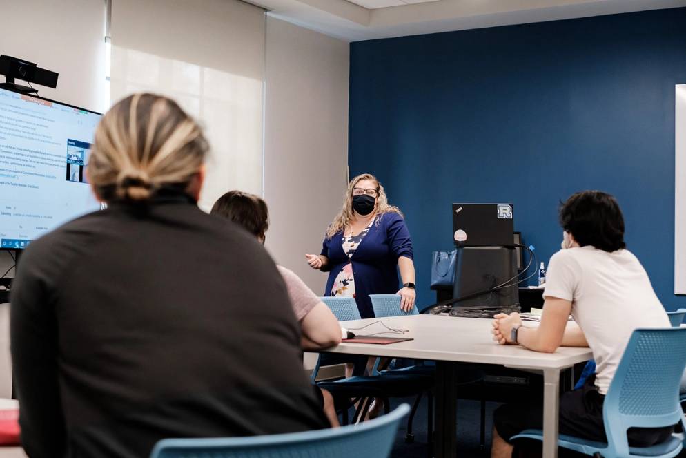 Hamilton Holt School students discuss Rollins’ signature approach to the liberal arts in a classroom in Kathleen W. Rollins Hall.