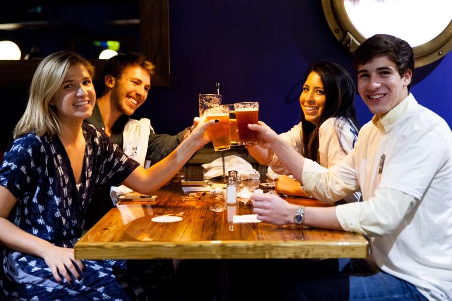 Students enjoy relaxing together at Dave’s Boathouse, the pub-style eatery on campus.