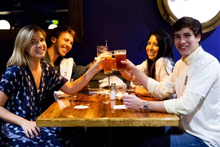 Students enjoy beers on tap at Dave’s Boathouse.