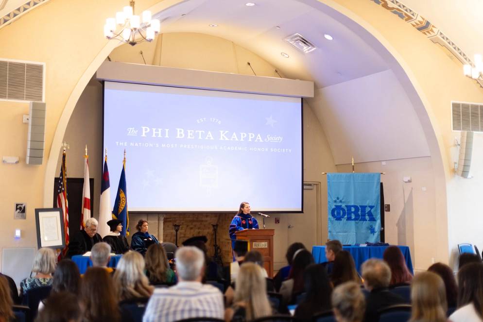 Theta President and art history professor MacKenzie Moon Ryan speaking at the PBK induction ceremony.