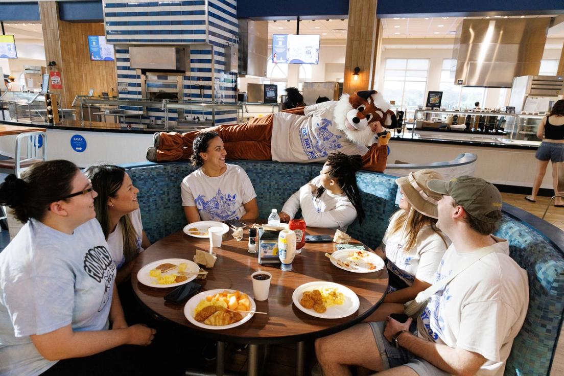 The fox joins students for breakfast before kicking off the day of Fox Day festivities.