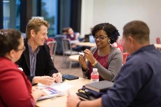 Hamilton Holt School students meet in the Bush Science Center to work on a group project.