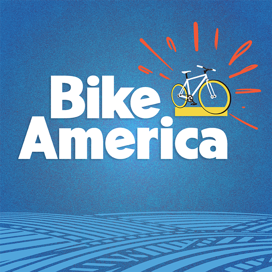 'Bike America' atop crisscrossing roads, next to a bicycle. 