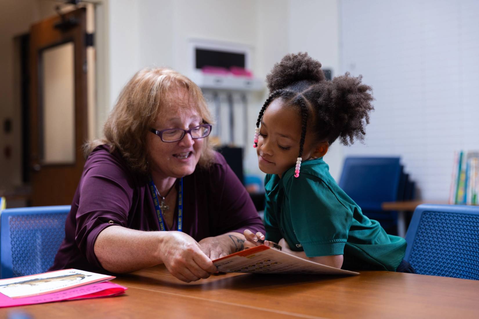 Photo of Laurie Pritchard, teacher at Educare, with Shanne Green's daughter 