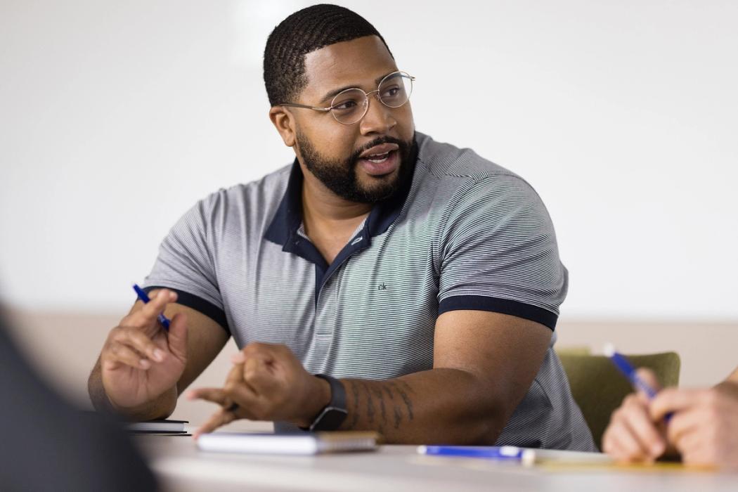 A Rollins professional advancement student sits in the classroom.