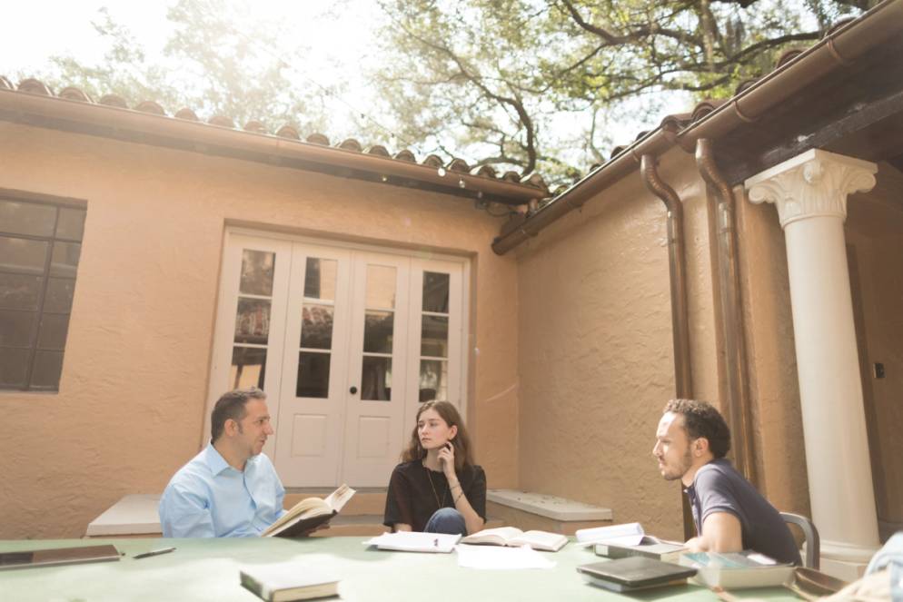 Religious Studies students hold class outside.