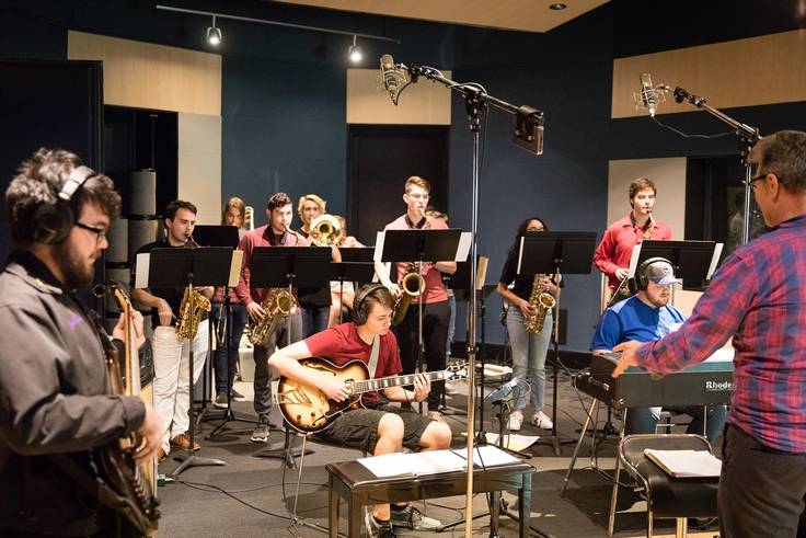 Rollins saxophone and guitar students perform in a recording studio