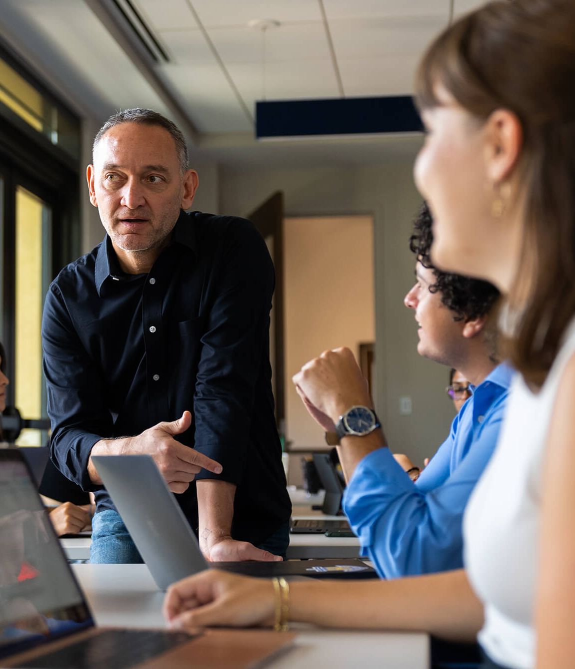 Rollins professor talks to students in a classroom discussion