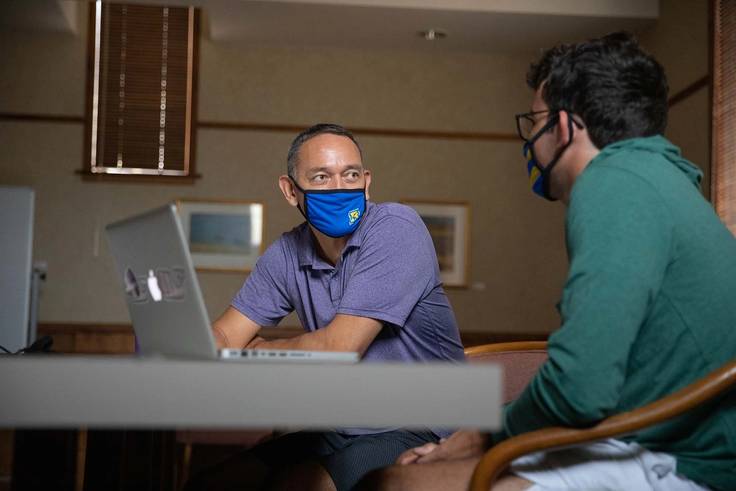 A student meets with their faculty advisor