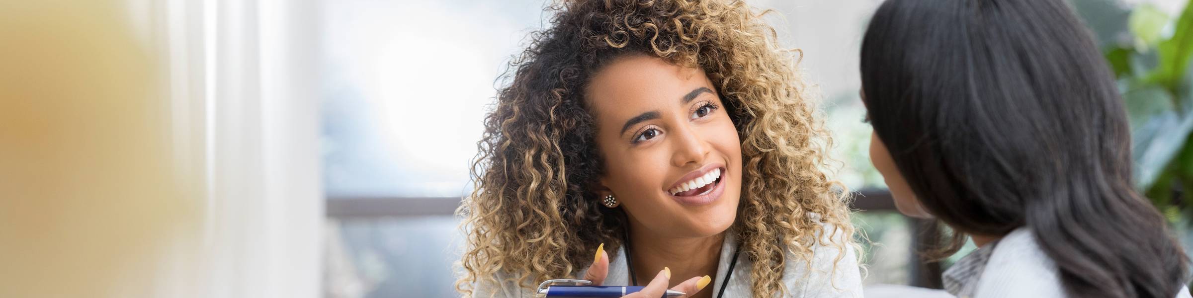 A counselor meets with a patient.