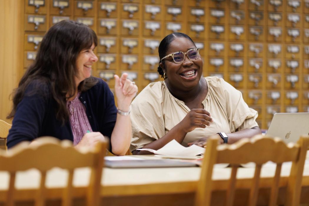 Rollins English professor works with a student one-on-one during a research project.