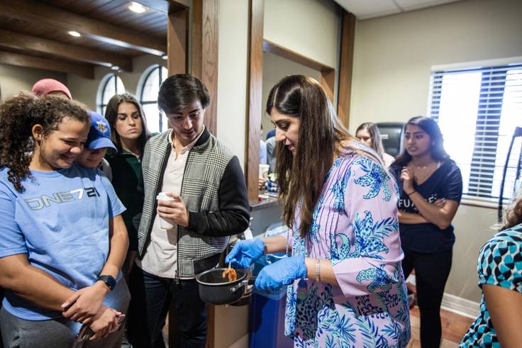 A Pakistani cooking demonstration in-progress.