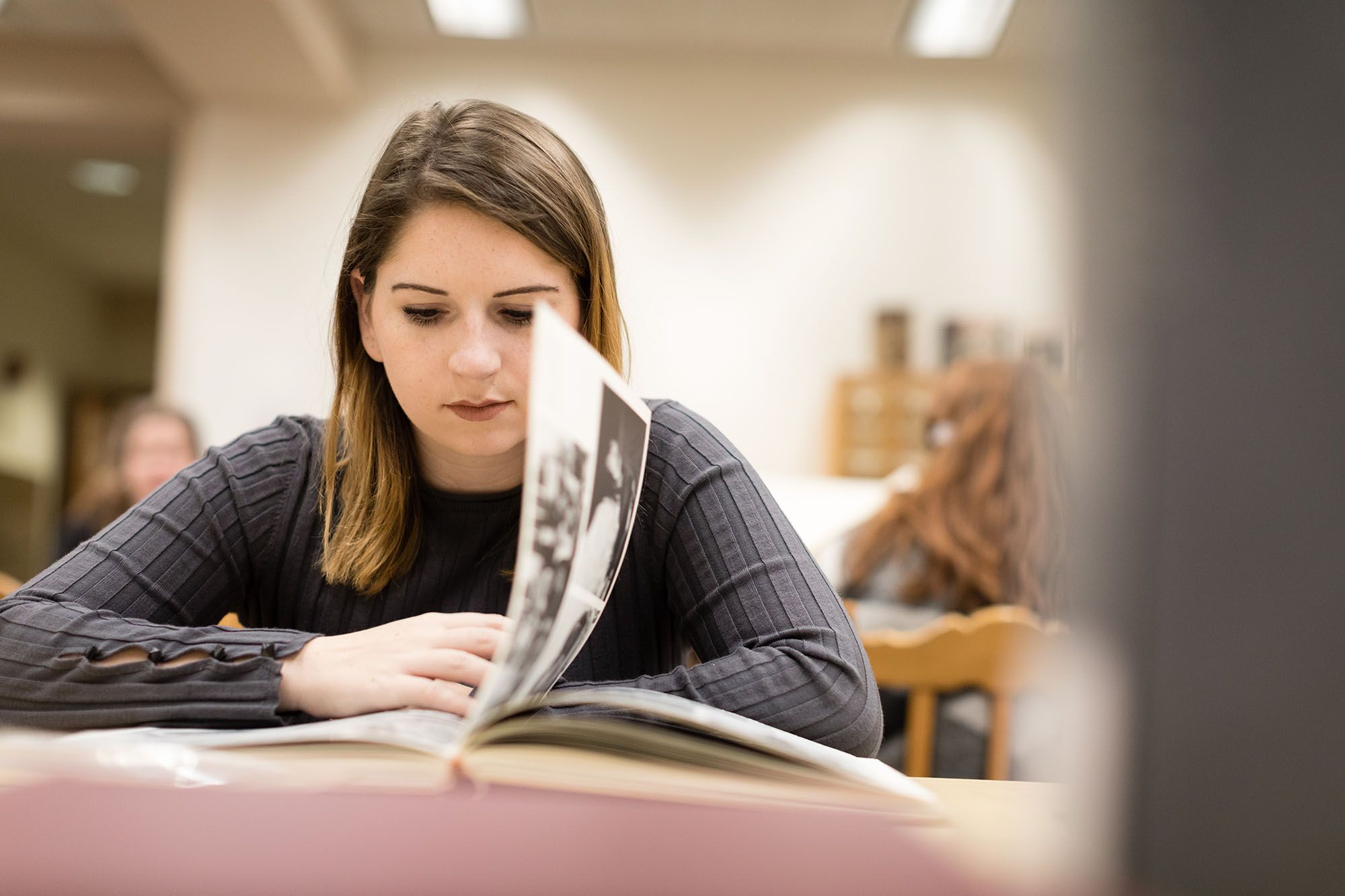 Student combing through the Rollins College Archives for history research. 