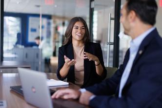 A business student meets one on one with a faculty advisor.