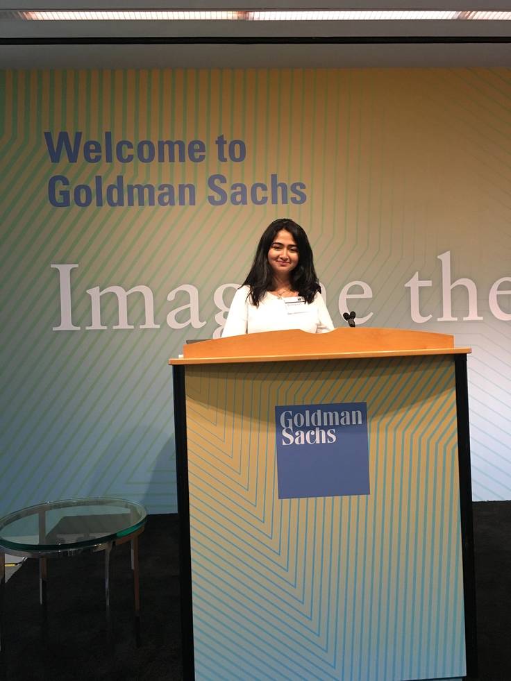 Maliha Qureshi ’19 speaking from the podium at Goldman Sachs in New York City.