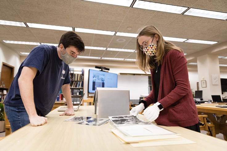 Students conduct research in Olin Library