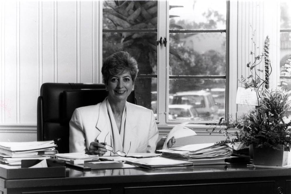 Rita Bornstein ’04H ’04HAL sitting at her desk