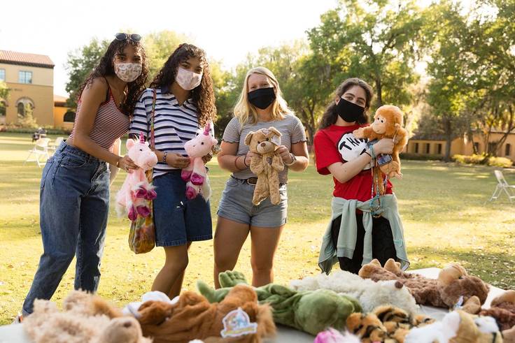 Students pose with stuffed animals