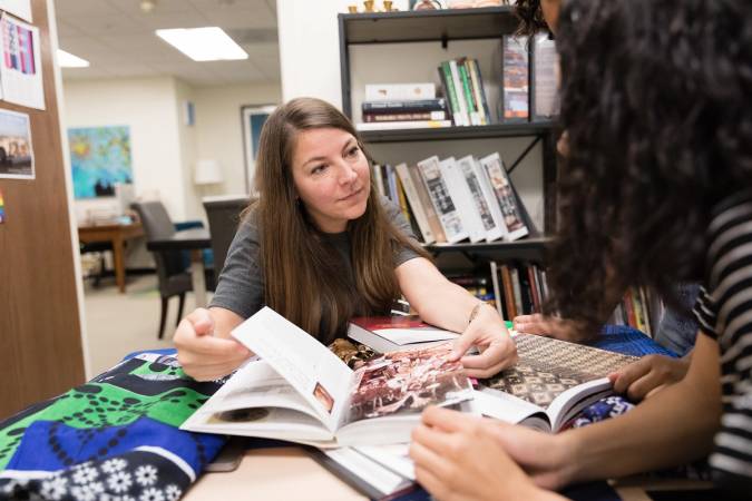 Art history professor working on original research with students.