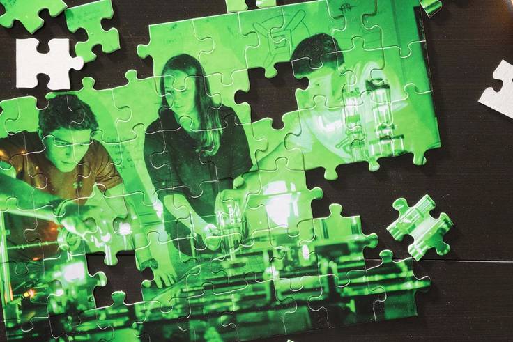 a puzzle featuring students in a science lab
