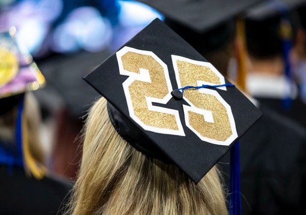 A group of seven alumni, various ages, at the GOLD event during Alumni Weekend 2024.