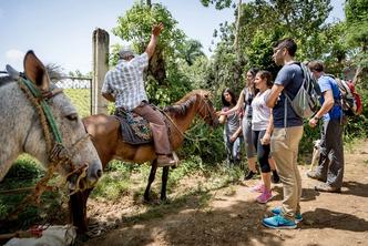 Students chat with a local in the Dominican Republic.