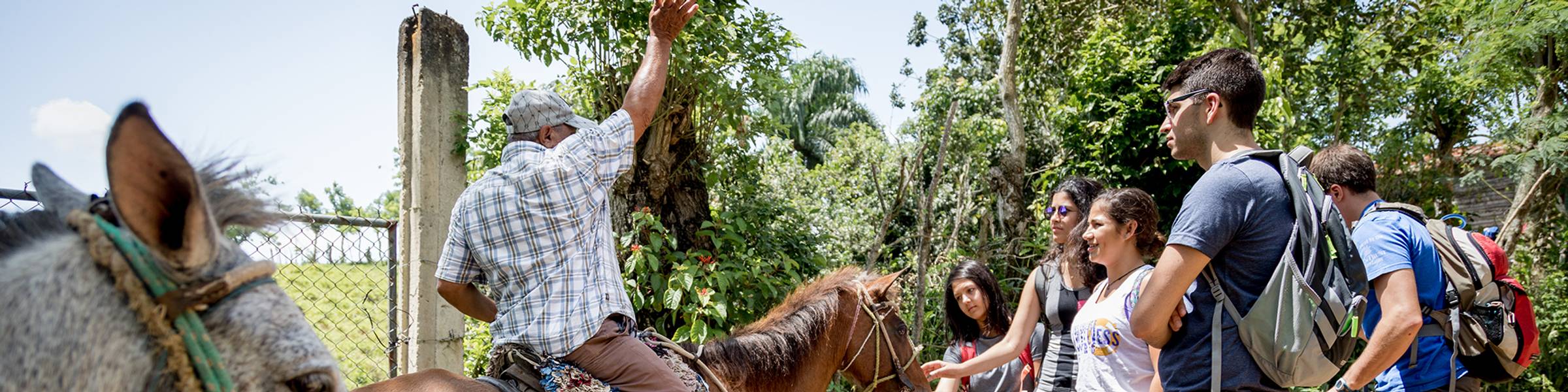 Students chat with a local in the Dominican Republic.