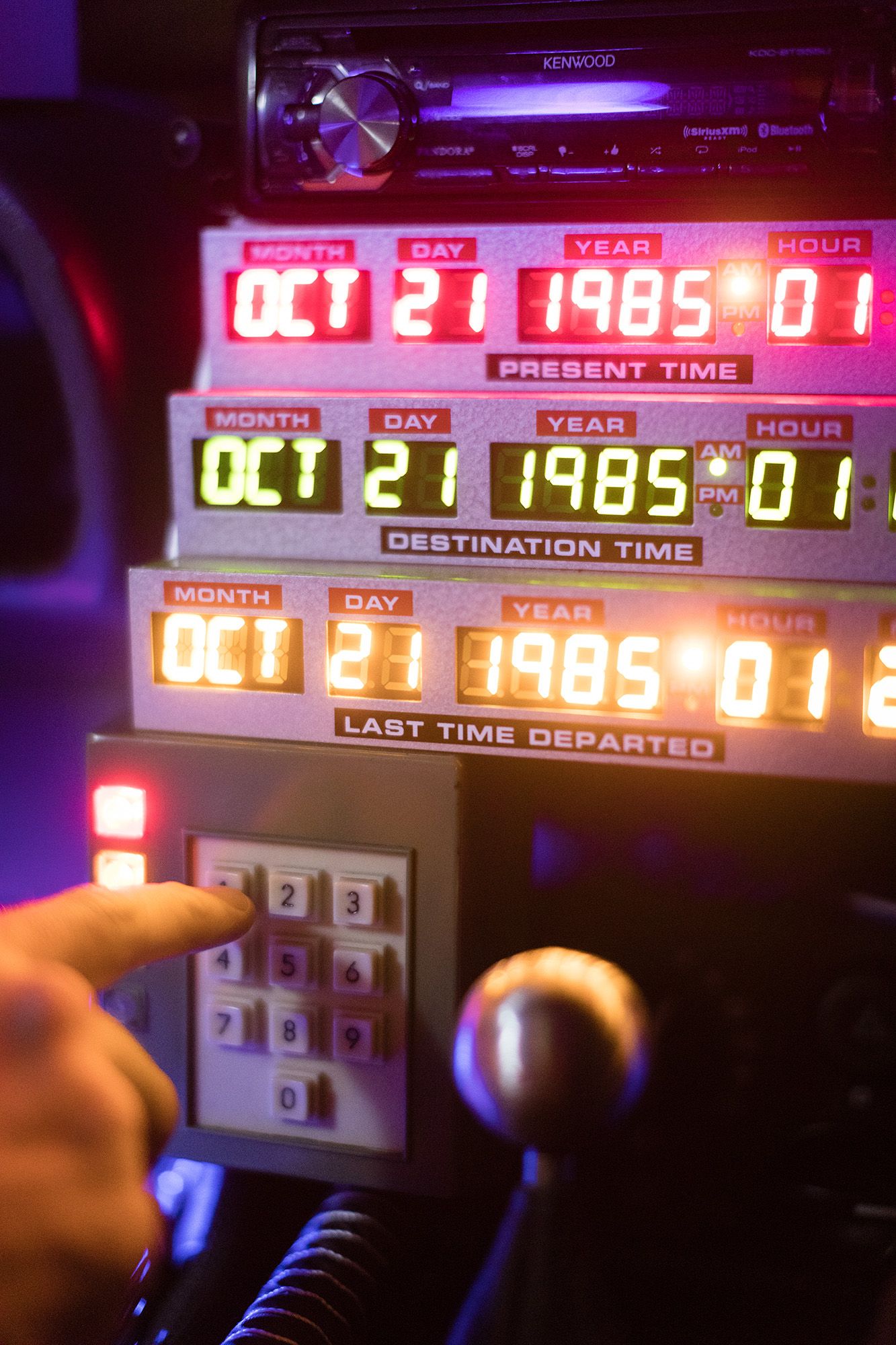 Chris Fuse punches a date into the console of the DeLorean