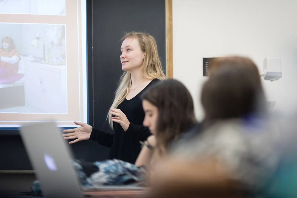 A student giving a presentation in class.