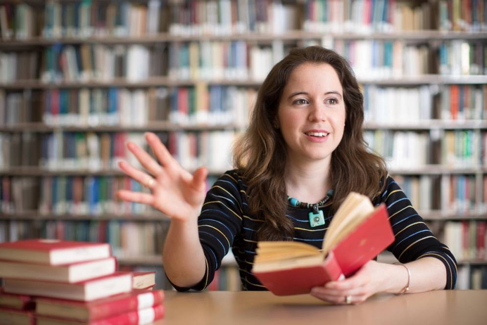 Cherie Ramirez talks about a book in the Olin Library.