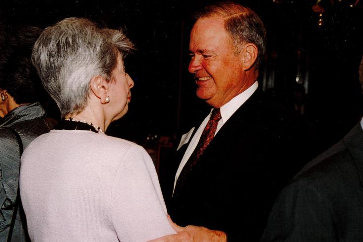 Harold Ward speaking with former Rollins president Rita Bornstein.