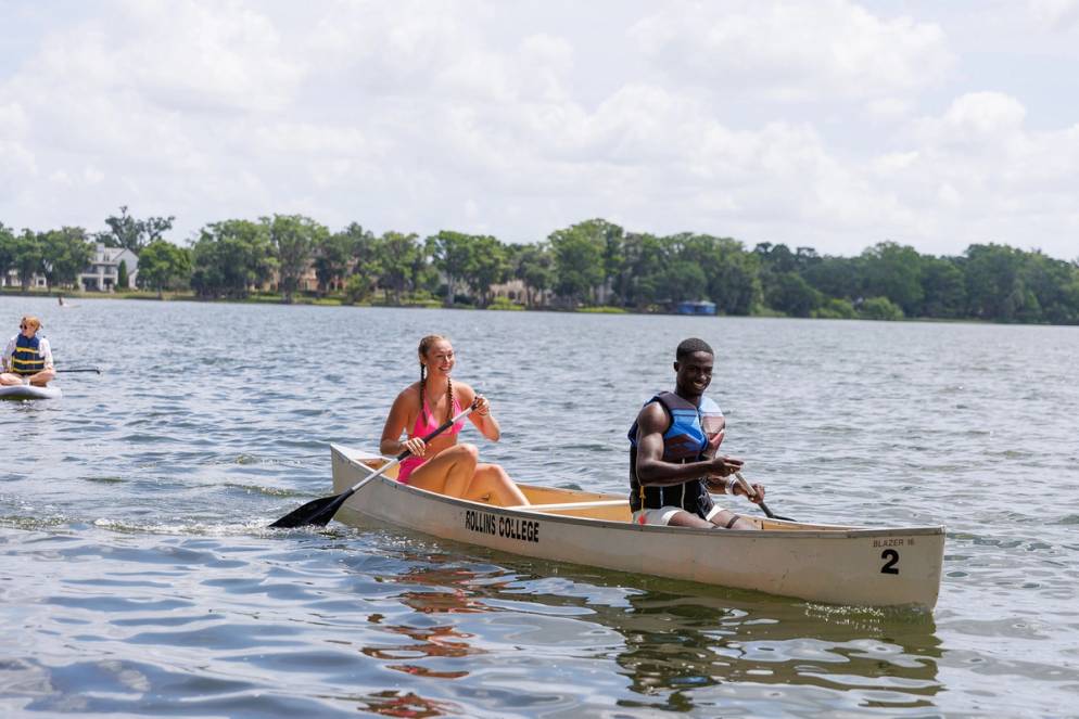 Students canoeing on Lake Virginia on Fox Day.